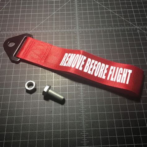 remove before flight tow strap